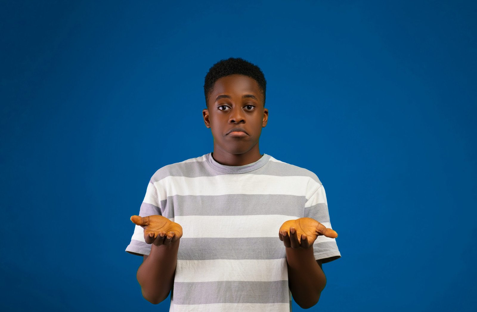 A young man wearing strip shirt